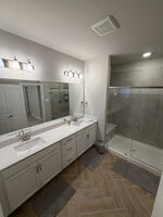 glass door shower with bench