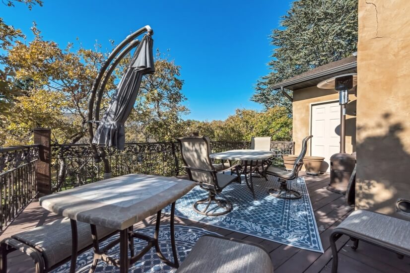 Private outdoor living and dining with huge umbrellas