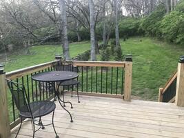 Secluded back deck off bedroom sitting area.