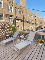 Unit 1 garage-roof deck with two loungers