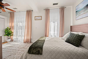 Queen bedroom with windows on two sides