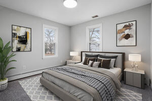 Fully furnished bedroom with queen bed