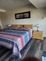 spacious bedroom with balcony walk out.