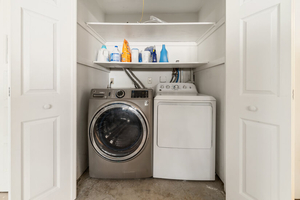 Laundry Closet with Washer, Dryer, and Storage Shelf