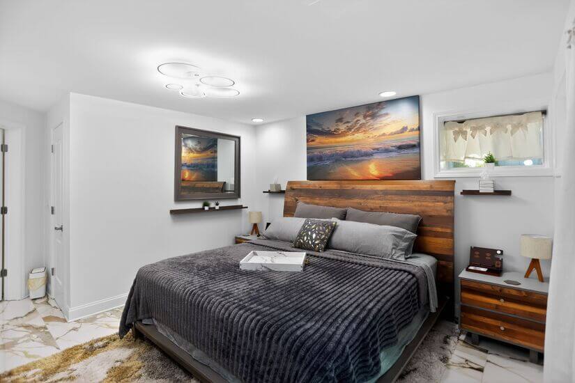 Primary: King bed w/ 4 device charging stations on stands