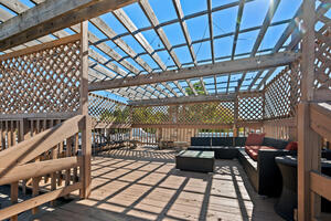 Private rooftop deck seating and pergola