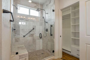 Primary ensuite walk-in shower and closet
