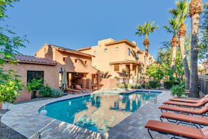 Community pool steps from property