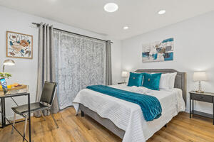 Upstairs bedroom, queen bed and desk