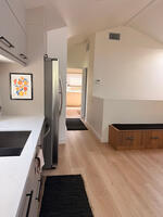 The hallway from the kitchen to the bath/bed