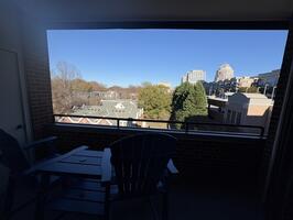 Covered balcony with city views