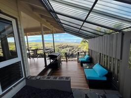 Covered lanai with seating and ocean view