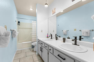 Primary suit bathroom with double vanities