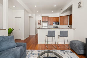 Open kitchen with breakfast-bar seating