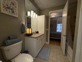 View of bathroom into bedroom