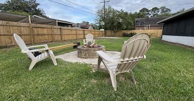 Large private fenced backyard with firepit