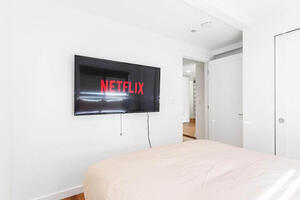 Relax in bed with mounted Smart TVs
