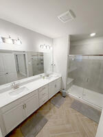 double vanity, glass shower with bench