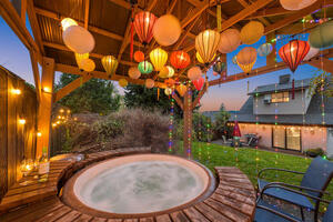 Historic home with a hot tub and lake view