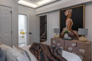 Chic vanity nook with stool + statement light