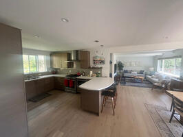 Open floor plan upstairs, with new kitchen and new furniture