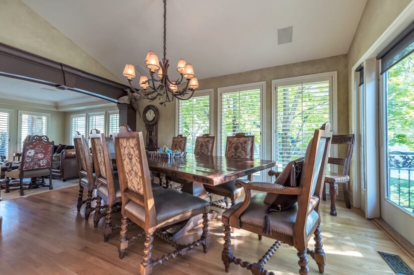 Dining room surrounded by windows & walk out deck