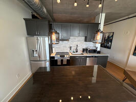 spacious kitchen with island, seats two