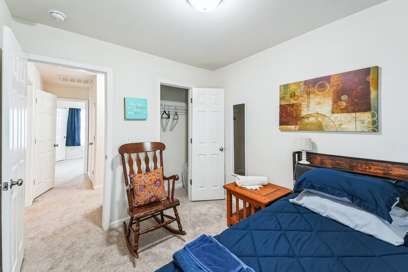 Bedroom is across from the bathroom.