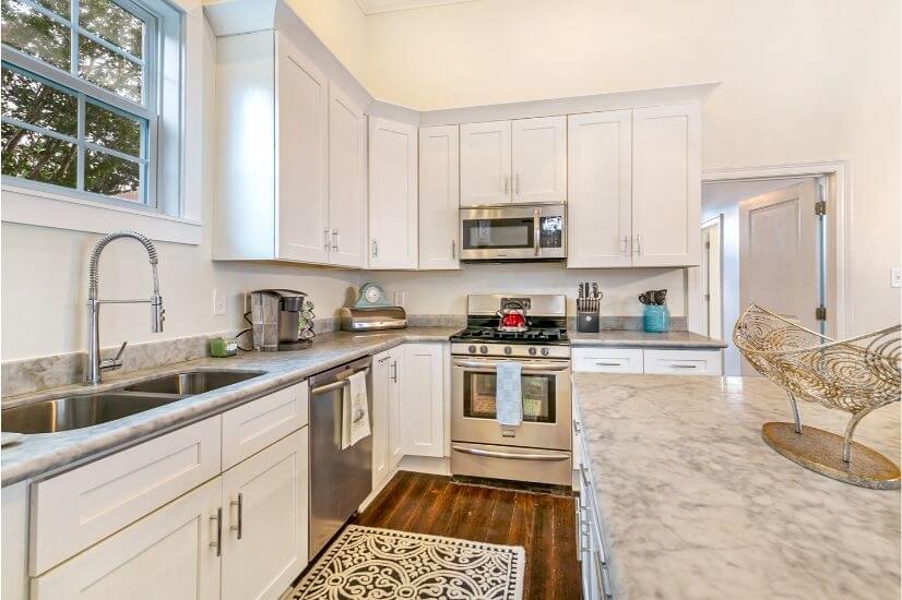 Upgraded kitchen with marble counters and lar