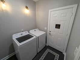 Laundry room with full washer and dryer