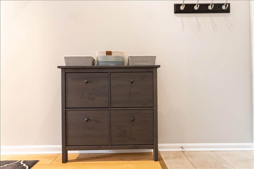 Entry features shoe storage and coat hooks