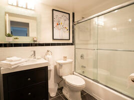 Spotless bathroom with modern vanity storage