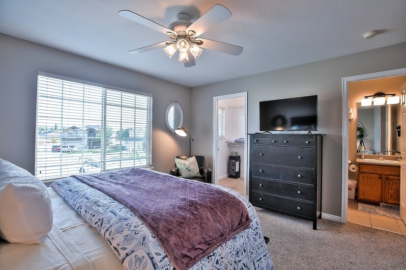 Master Bedroom with smart TV and walk in clos