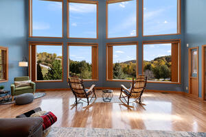 Floor-to-ceiling windows fill the home