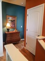 The landing features a spacious coat closet
