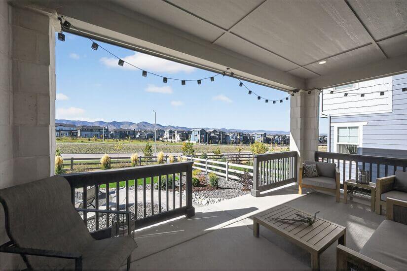Furnished back porch w/ decorative lighting & mountain views