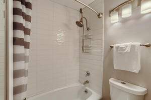 Modern tiled tub surround for a relaxing bath or shower.