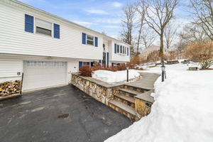 Front Exterior with Entry Walkway and Garage