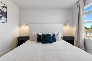 Wood platform bed with modern farmhouse touches.