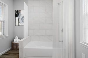 Bathroom with bathtub and shower