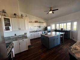 Kitchen with island, double ovens, two refrig
