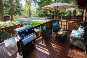 Spacious deck with grill, seating, umbrella.