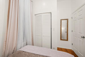 Queen bedroom with closet storage