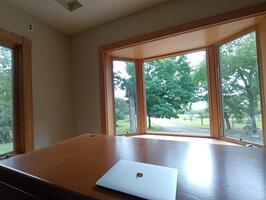 Office views toward lake and woodlands