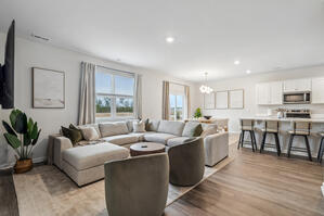 Relax in style with a plush sectional and boucle chairs