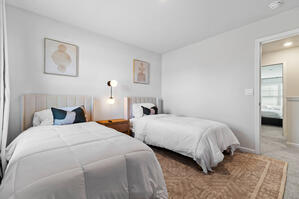 Elegant wingback bed with dimmable wall sconces