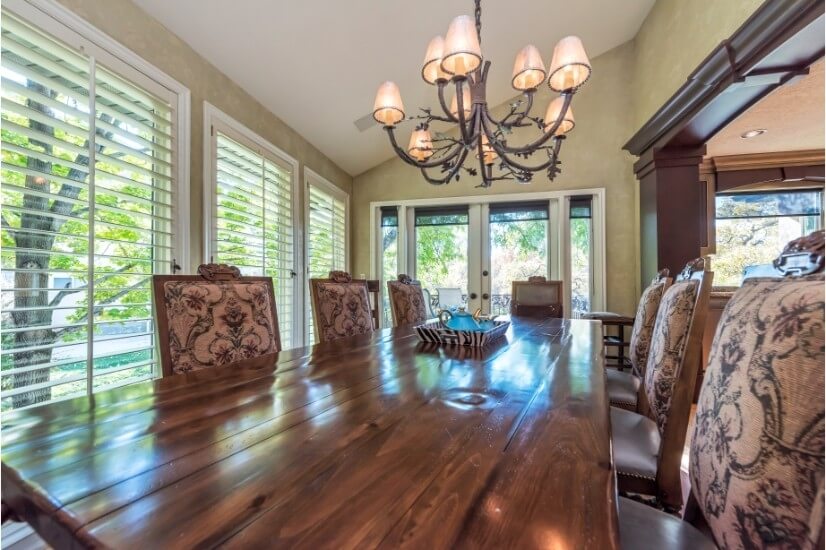 Hand carved dining table & 8 chairs w/ Hammerton chandelier