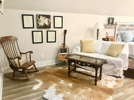 Upstairs hayloft sitting area overlooking back deck.