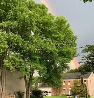 Rainbow over house