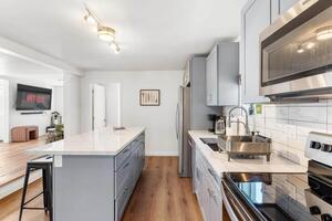 Full kitchen with cookware, appliances, space